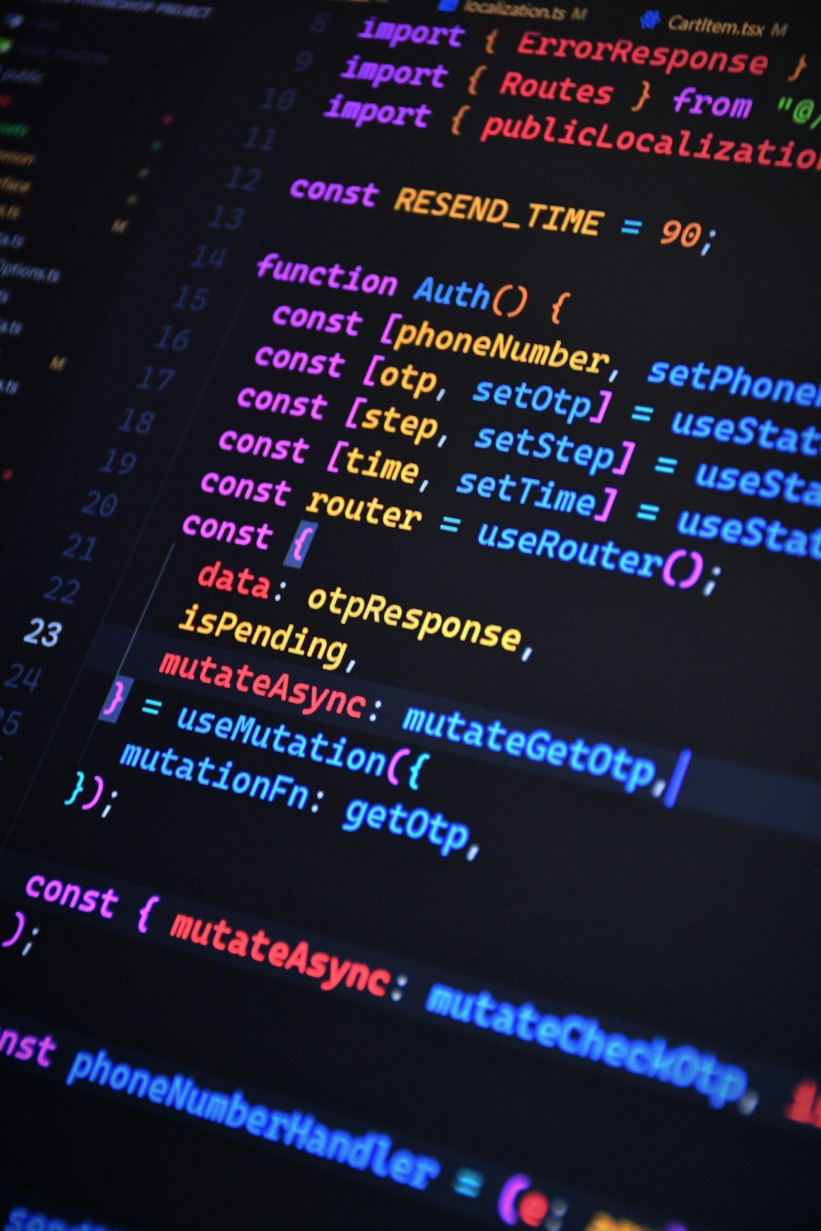 Close-up of vibrant JavaScript code for web development with ReactJS and Tailwind CSS.