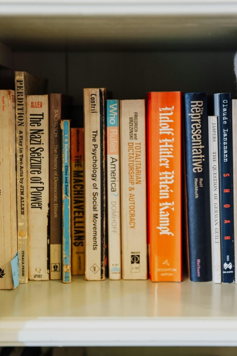 A shelf displaying a selection of books on history and politics, including titles focused on social movements and political regimes.